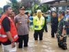 Kapolres Binjai Turun Langsung Evakuasi Masyarakat yang Terjebak Banjir di Kota Binjai